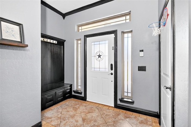 5901 NE Watts Rd, Elgin, OK 73538 - entrance foyer featuring ornamental molding, a textured wall, and light tile patterned floors