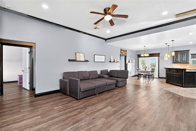 5901 NE Watts Rd, Elgin, OK 73538 - living room featuring wood finished floors, ceiling fan, recessed lighting, and french doors
