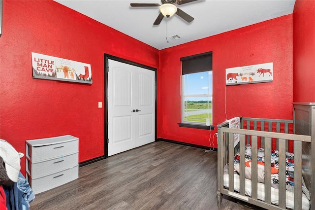 5901 NE Watts Rd, Elgin, OK 73538 - bedroom with a textured wall, wood finished floors, a ceiling fan, and a closet