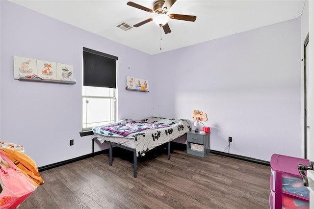 5901 NE Watts Rd, Elgin, OK 73538 - bedroom featuring wood finished floors and ceiling fan