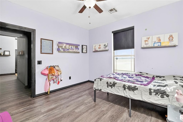 5901 NE Watts Rd, Elgin, OK 73538 - bedroom featuring wood finished floors and ceiling fan