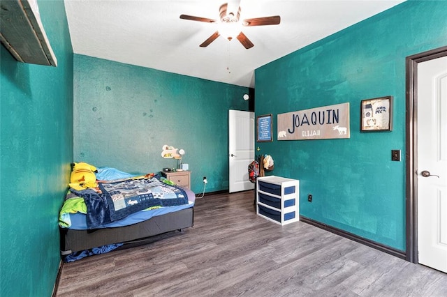 5901 NE Watts Rd, Elgin, OK 73538 - bedroom featuring wood finished floors and ceiling fan