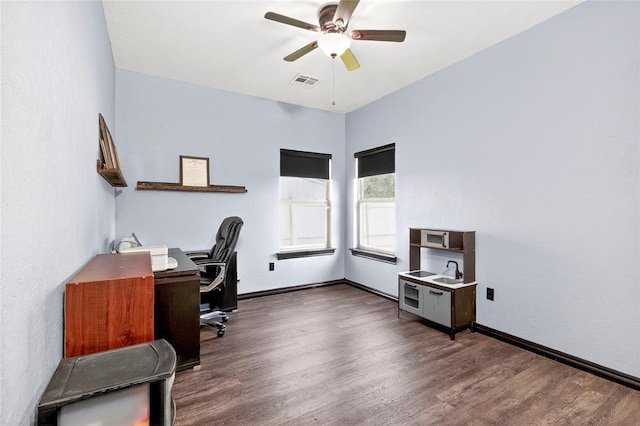 5901 NE Watts Rd, Elgin, OK 73538 - office area featuring ceiling fan and dark wood-type flooring