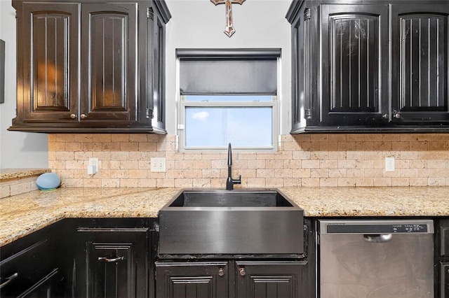 5901 NE Watts Rd, Elgin, OK 73538 - kitchen with stainless steel dishwasher, tasteful backsplash, and light stone countertops