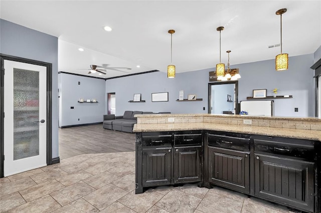 5901 NE Watts Rd, Elgin, OK 73538 - kitchen featuring ceiling fan, decorative light fixtures, open floor plan, recessed lighting, and light stone counters