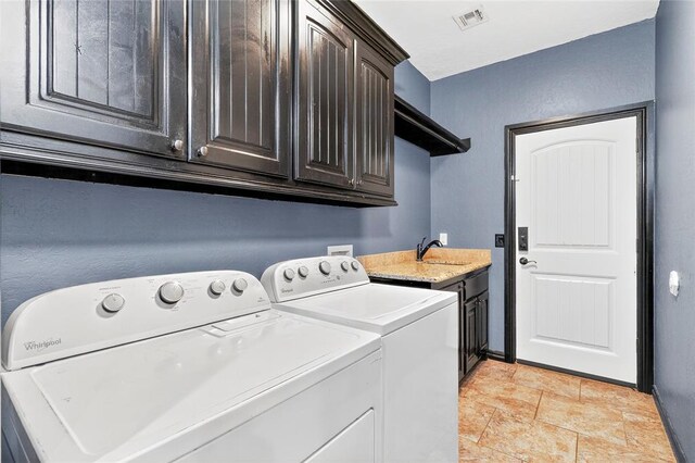 5901 NE Watts Rd, Elgin, OK 73538 - laundry area featuring cabinet space and separate washer and dryer