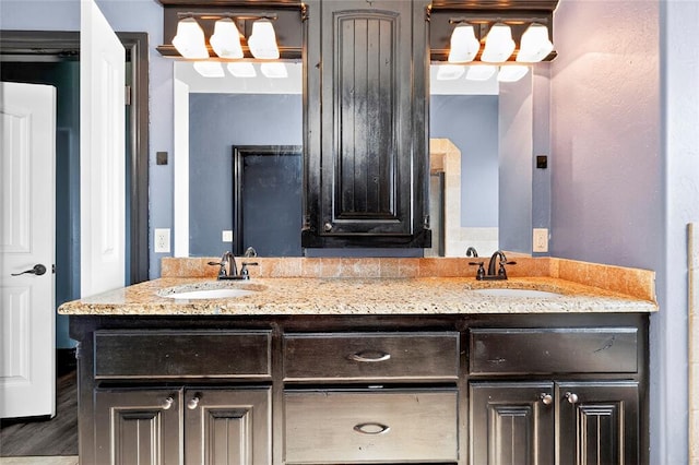 5901 NE Watts Rd, Elgin, OK 73538 - full bathroom featuring double vanity and wood finished floors
