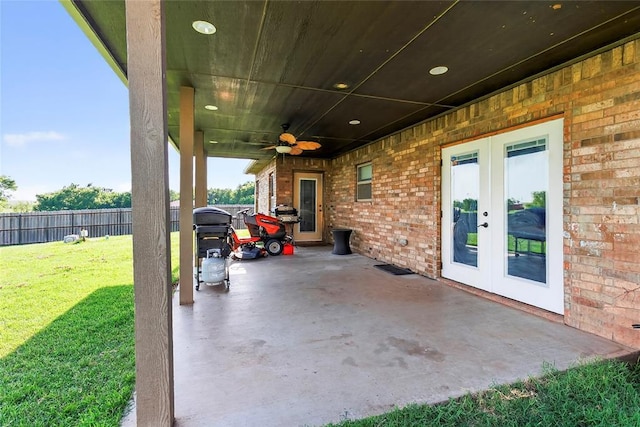 5901 NE Watts Rd, Elgin, OK 73538 - view of patio featuring french doors, ceiling fan, a carport, and grilling area