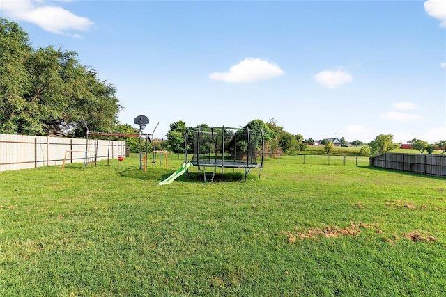 5901 NE Watts Rd, Elgin, OK 73538 - fenced backyard with a trampoline