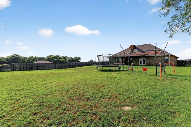 5901 NE Watts Rd, Elgin, OK 73538 - fenced backyard with a trampoline