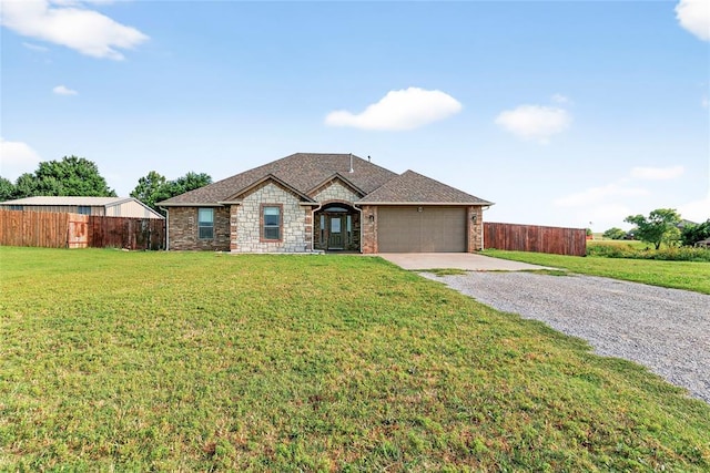 5901 NE Watts Rd, Elgin, OK 73538 - view of front of home with driveway, a garage, and stone siding