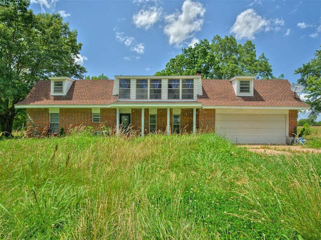 356818 E 1070th Rd, Prague, OK 74864 - view of front of home featuring brick siding and an attached garage