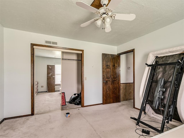 356818 E 1070th Rd, Prague, OK 74864 - workout area featuring carpet floors, a ceiling fan, and a textured ceiling