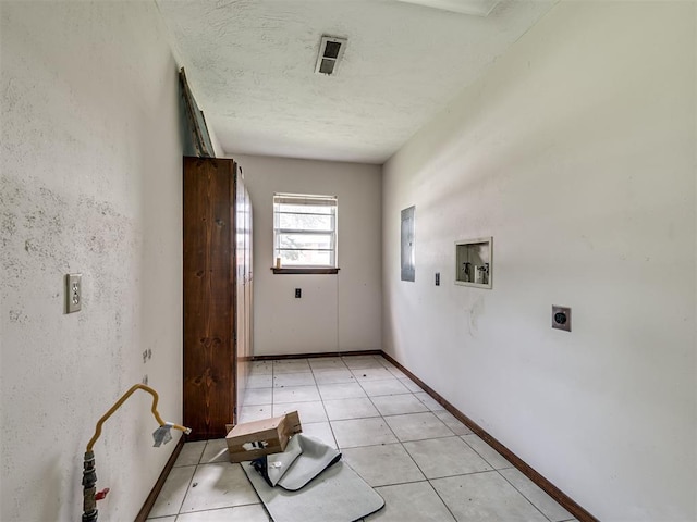 356818 E 1070th Rd, Prague, OK 74864 - laundry area with electric dryer hookup, washer hookup, light tile patterned flooring, and electric panel