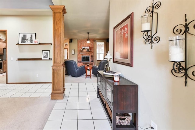 2704 Jills Trl, Edmond, OK 73012 - corridor with decorative columns, light colored carpet, and light tile patterned floors