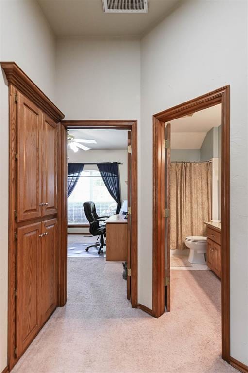 2704 Jills Trl, Edmond, OK 73012 - hallway featuring light colored carpet and an office area