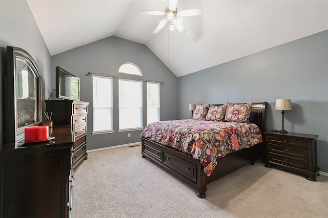 2704 Jills Trl, Edmond, OK 73012 - bedroom with vaulted ceiling, light carpet, and ceiling fan
