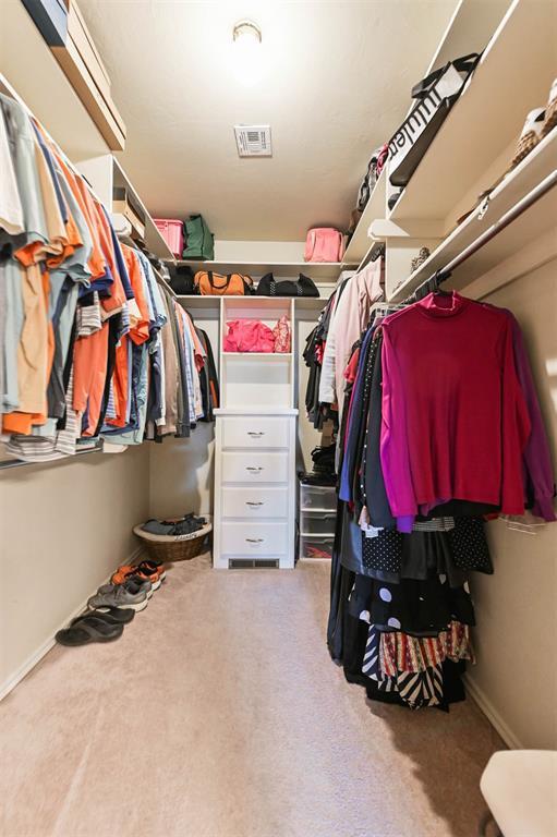 2704 Jills Trl, Edmond, OK 73012 - spacious closet featuring carpet floors