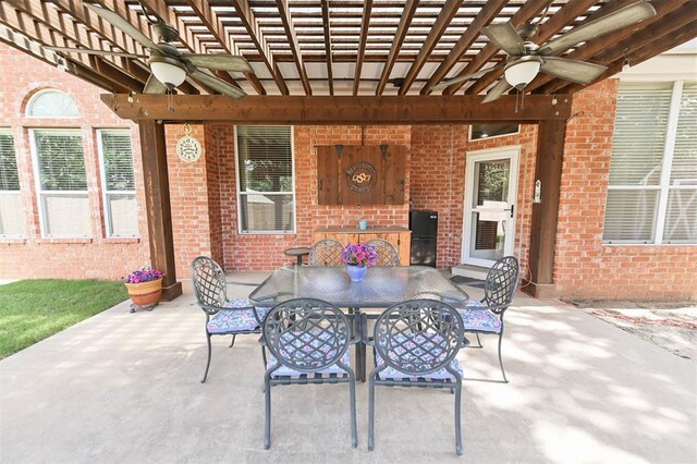 2704 Jills Trl, Edmond, OK 73012 - view of patio featuring ceiling fan, outdoor dining area, and a pergola