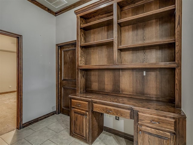 11749 SW 16th St, Yukon, OK 73099 - unfurnished office featuring ornamental molding, built in desk, and light tile patterned floors