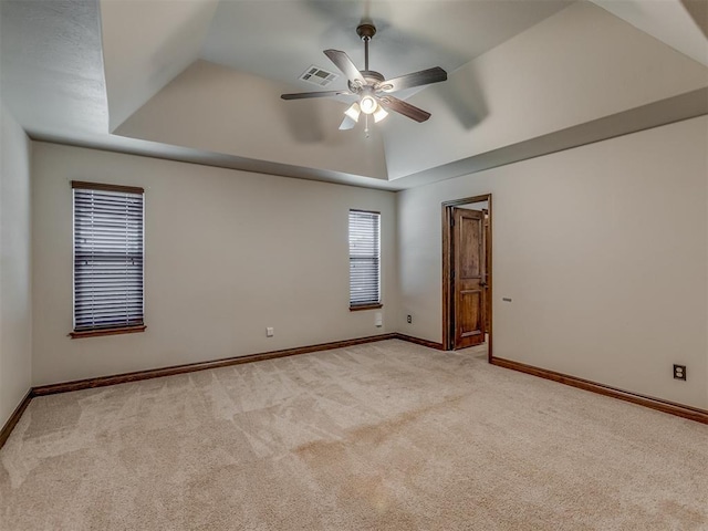 11749 SW 16th St, Yukon, OK 73099 - empty room with carpet, a ceiling fan, a tray ceiling, and lofted ceiling