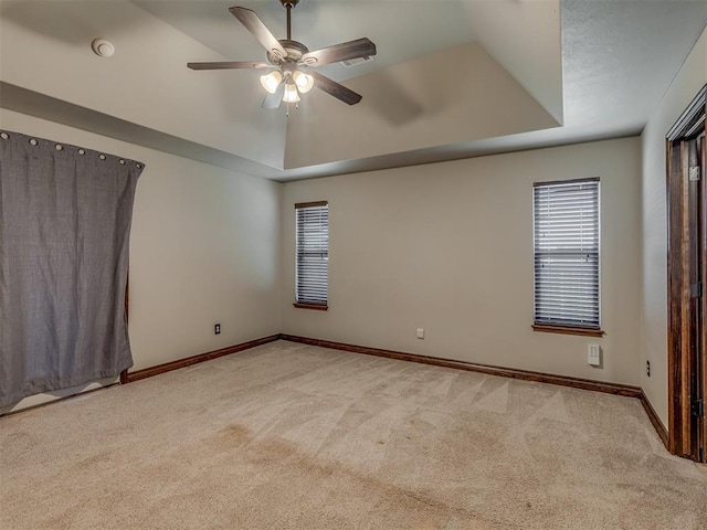 11749 SW 16th St, Yukon, OK 73099 - unfurnished room featuring carpet floors, ceiling fan, a tray ceiling, and a smoke detector