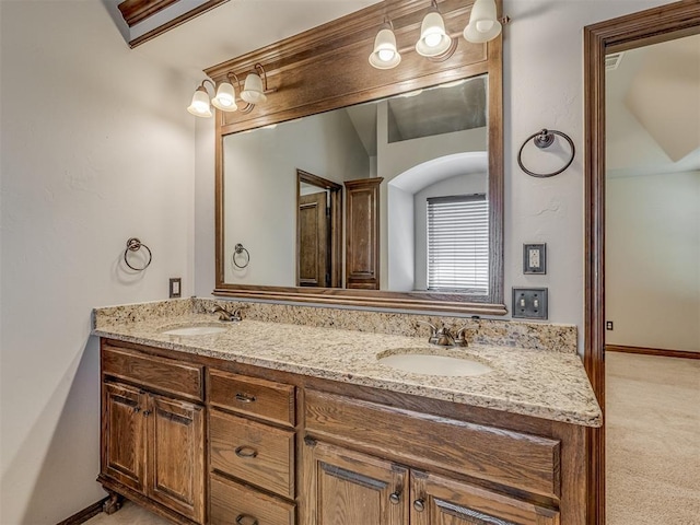 11749 SW 16th St, Yukon, OK 73099 - bathroom featuring double vanity and baseboards