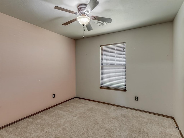 11749 SW 16th St, Yukon, OK 73099 - unfurnished room with light colored carpet and a ceiling fan
