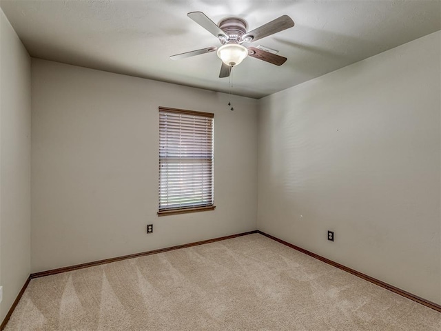 11749 SW 16th St, Yukon, OK 73099 - empty room with light colored carpet and a ceiling fan