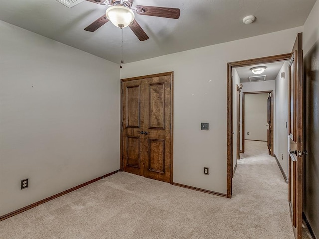 11749 SW 16th St, Yukon, OK 73099 - unfurnished bedroom with light carpet and a ceiling fan