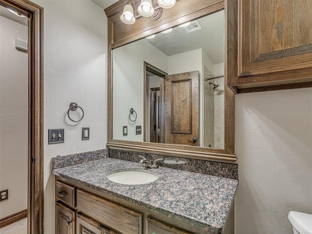 11749 SW 16th St, Yukon, OK 73099 - bathroom featuring vanity and toilet