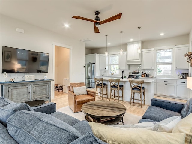 75 Lower Green Way, Carlton Landing, OK 74432 - living area featuring light wood-type flooring, a ceiling fan, and recessed lighting