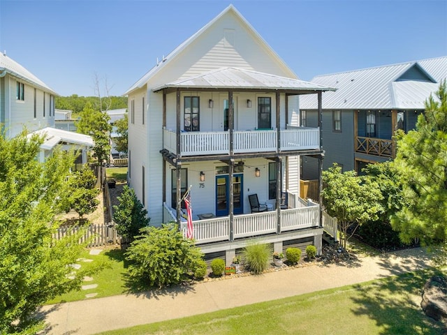 75 Lower Green Way, Carlton Landing, OK 74432 - view of front facade with a balcony, ceiling fan, and a metal roof