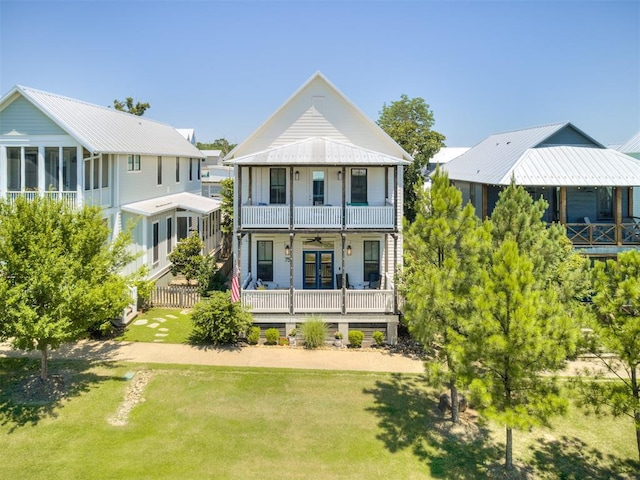 75 Lower Green Way, Carlton Landing, OK 74432 - view of front of house featuring a ceiling fan, a front lawn, a balcony, and covered porch