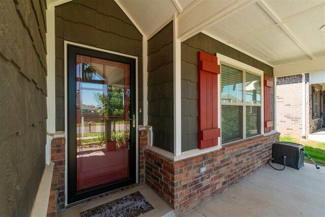 12904 SW 8th St, Yukon, OK 73099 - entrance to property with a porch and brick siding
