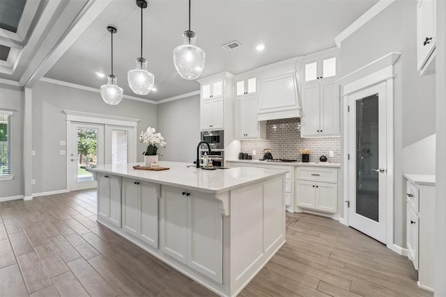 12904 SW 8th St, Yukon, OK 73099 - kitchen featuring premium range hood, backsplash, appliances with stainless steel finishes, white cabinets, and ornamental molding