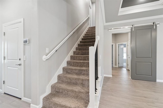 12904 SW 8th St, Yukon, OK 73099 - staircase with wood finished floors and a barn door