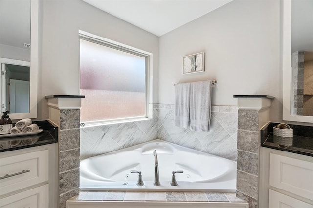 12904 SW 8th St, Yukon, OK 73099 - bathroom featuring vanity and a tub with jets