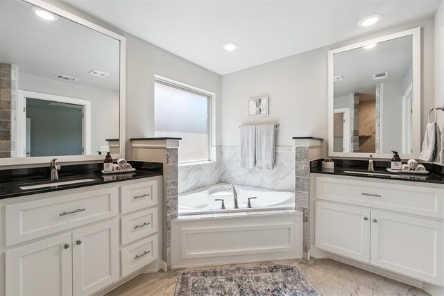 12904 SW 8th St, Yukon, OK 73099 - full bath featuring two vanities, a bath, and recessed lighting