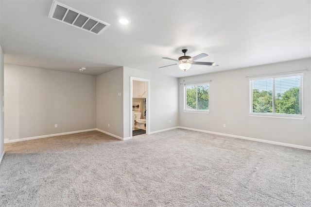 12904 SW 8th St, Yukon, OK 73099 - carpeted spare room with ceiling fan and baseboards