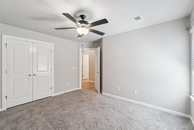 12904 SW 8th St, Yukon, OK 73099 - unfurnished bedroom with carpet flooring, a closet, and ceiling fan
