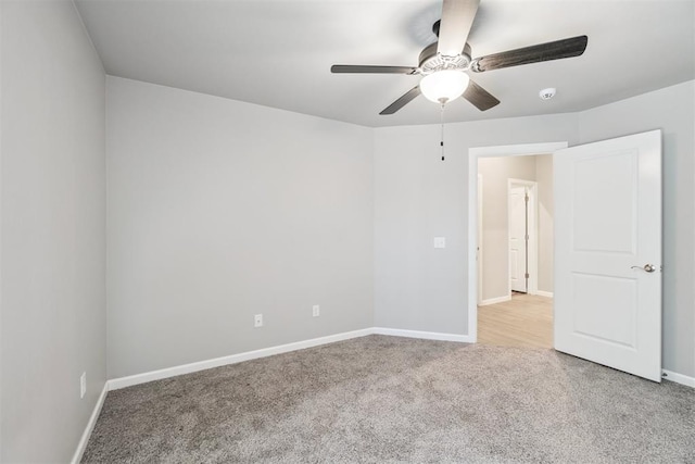 12904 SW 8th St, Yukon, OK 73099 - carpeted spare room featuring a ceiling fan and baseboards