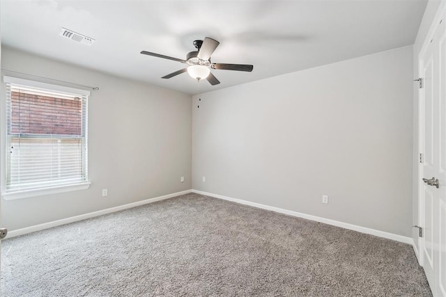 12904 SW 8th St, Yukon, OK 73099 - carpeted spare room with ceiling fan and baseboards