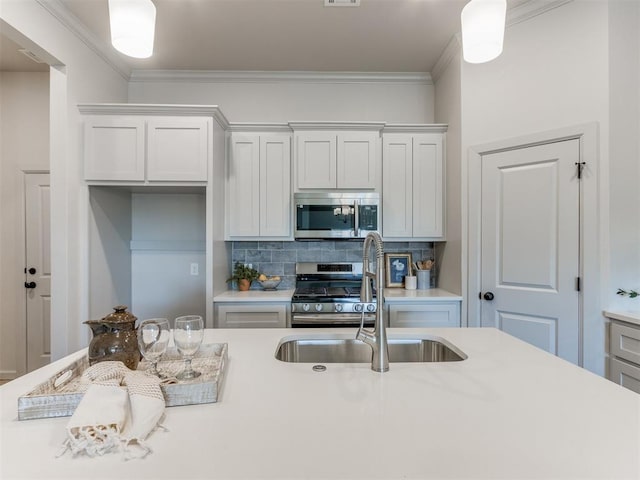 11700 SW 15th Ter, Yukon, OK 73099 - kitchen with stainless steel appliances, light countertops, decorative backsplash, and ornamental molding