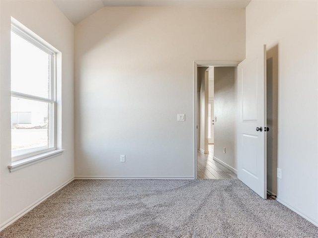 11700 SW 15th Ter, Yukon, OK 73099 - unfurnished room with carpet floors and lofted ceiling