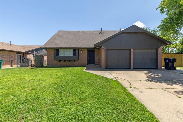 4800 SE 45th St, Oklahoma City, OK 73135 - single story home featuring a garage, brick siding, concrete driveway, and roof with shingles