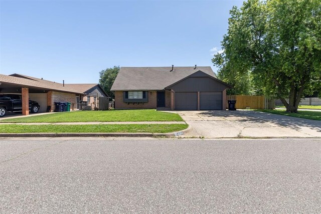 4800 SE 45th St, Oklahoma City, OK 73135 - single story home with an attached garage and driveway