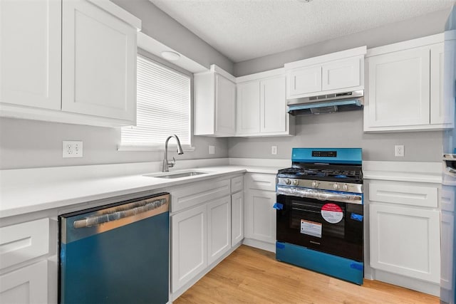 4800 SE 45th St, Oklahoma City, OK 73135 - kitchen featuring stainless steel gas range oven, dishwasher, under cabinet range hood, white cabinets, and a textured ceiling
