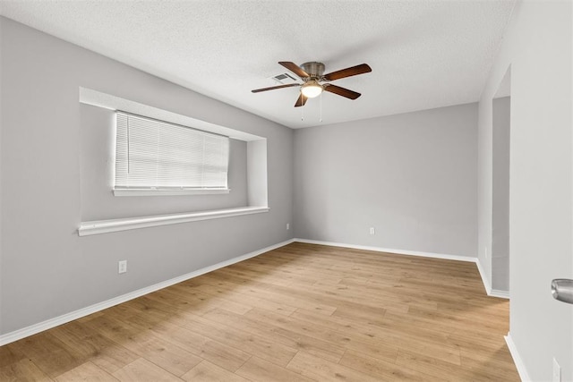 4800 SE 45th St, Oklahoma City, OK 73135 - spare room with ceiling fan, light wood-style floors, and a textured ceiling
