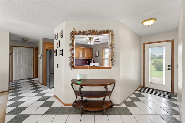 910796 S 3350th Rd, Wellston, OK 74881 - entryway featuring baseboards and a ceiling fan